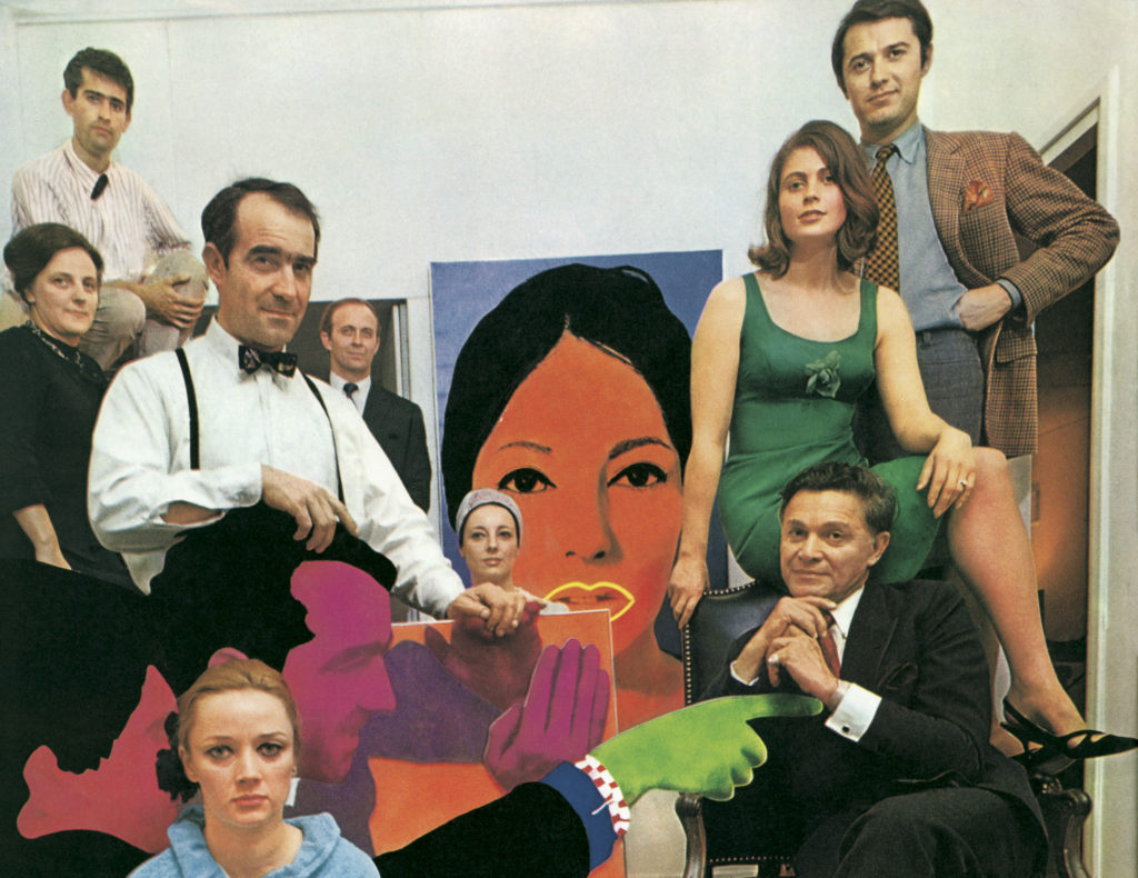 Alexander Iolas, seated, with a group of artists and friends among Pop Art works
